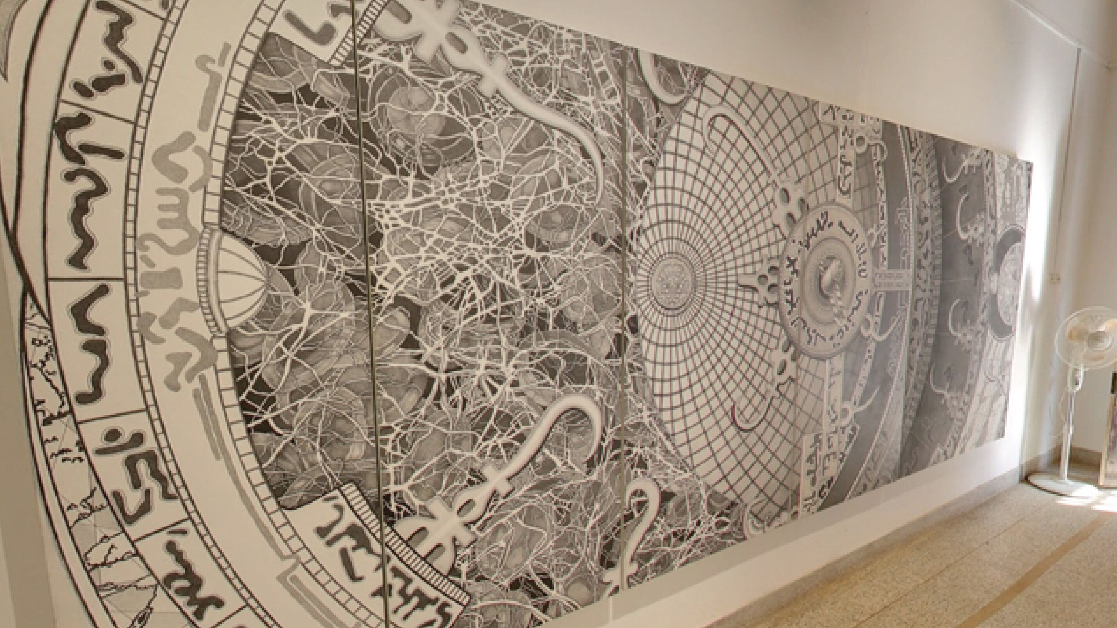 A large, intricate wall mural with complex patterns and designs.