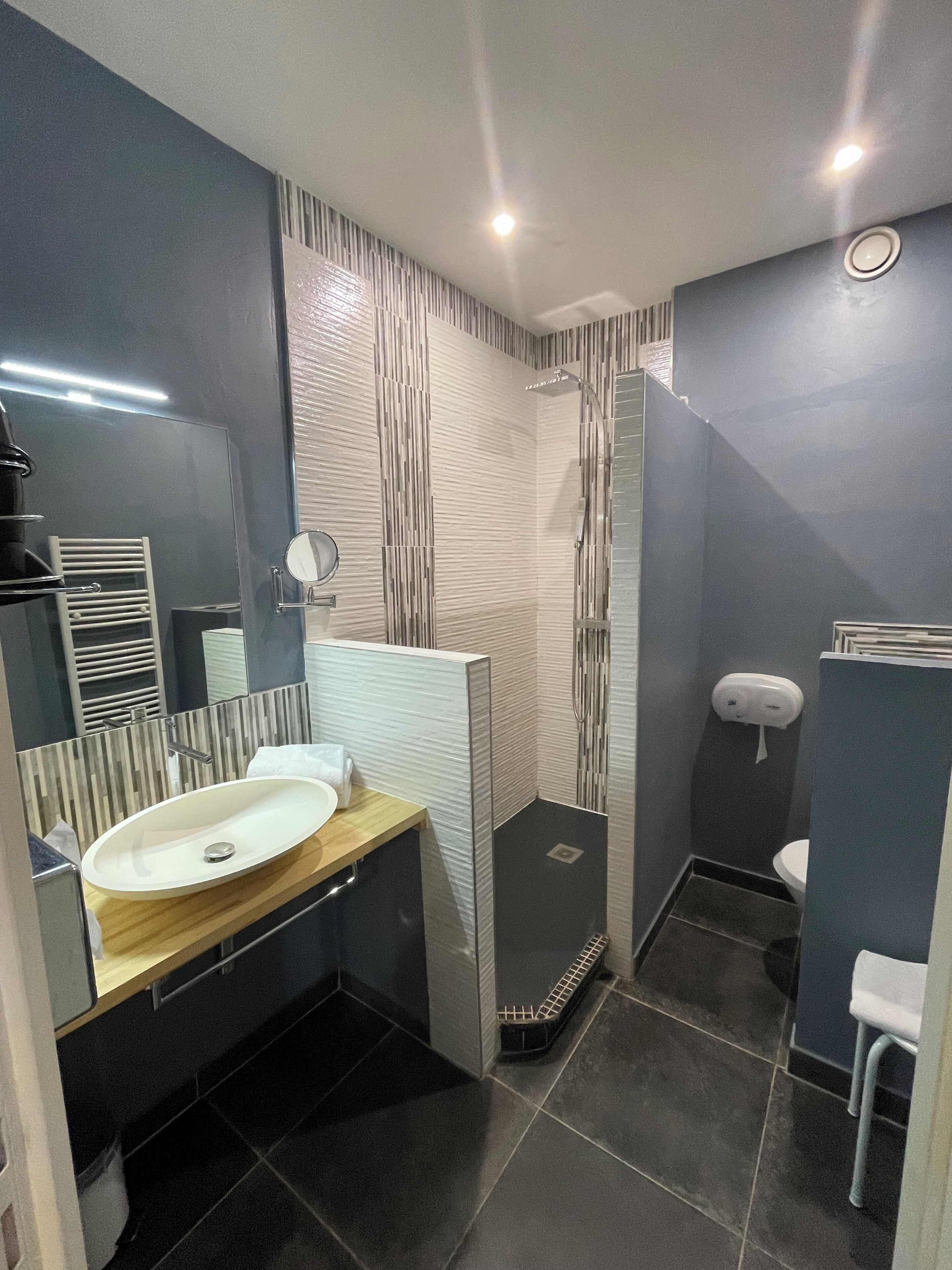 superior quadruple room | bathroom | rainfall showerhead, free toiletries, hair dryer