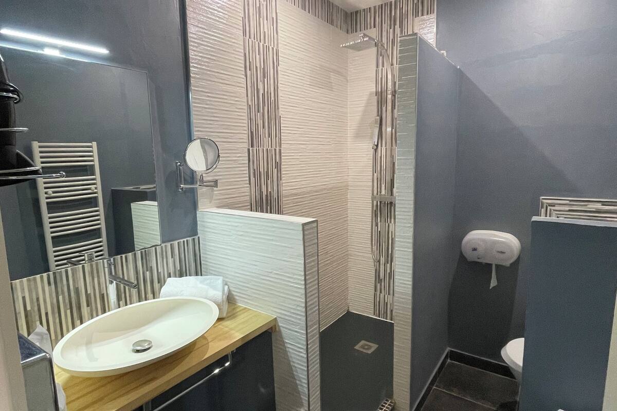 superior quadruple room | bathroom | rainfall showerhead, free toiletries, hair dryer