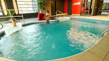 Indoor pool, open 8:00 AM to 10:00 PM, pool loungers