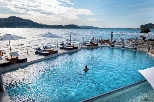 Seasonal outdoor pool, open 9:30 AM to 6:30 PM, pool umbrellas
