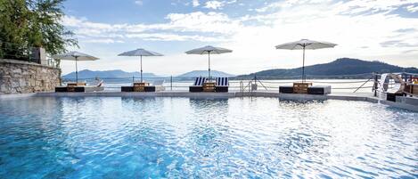 Seasonal outdoor pool, open 9:30 AM to 6:30 PM, pool umbrellas