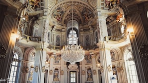 An ornate interior with a grand chandelier, high ceilings, and detailed frescoes. - Resort Antico Verbano (Meina)