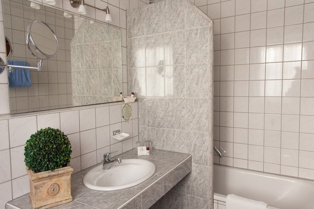 deluxe room, balcony | bathroom amenities | hair dryer, slippers, towels