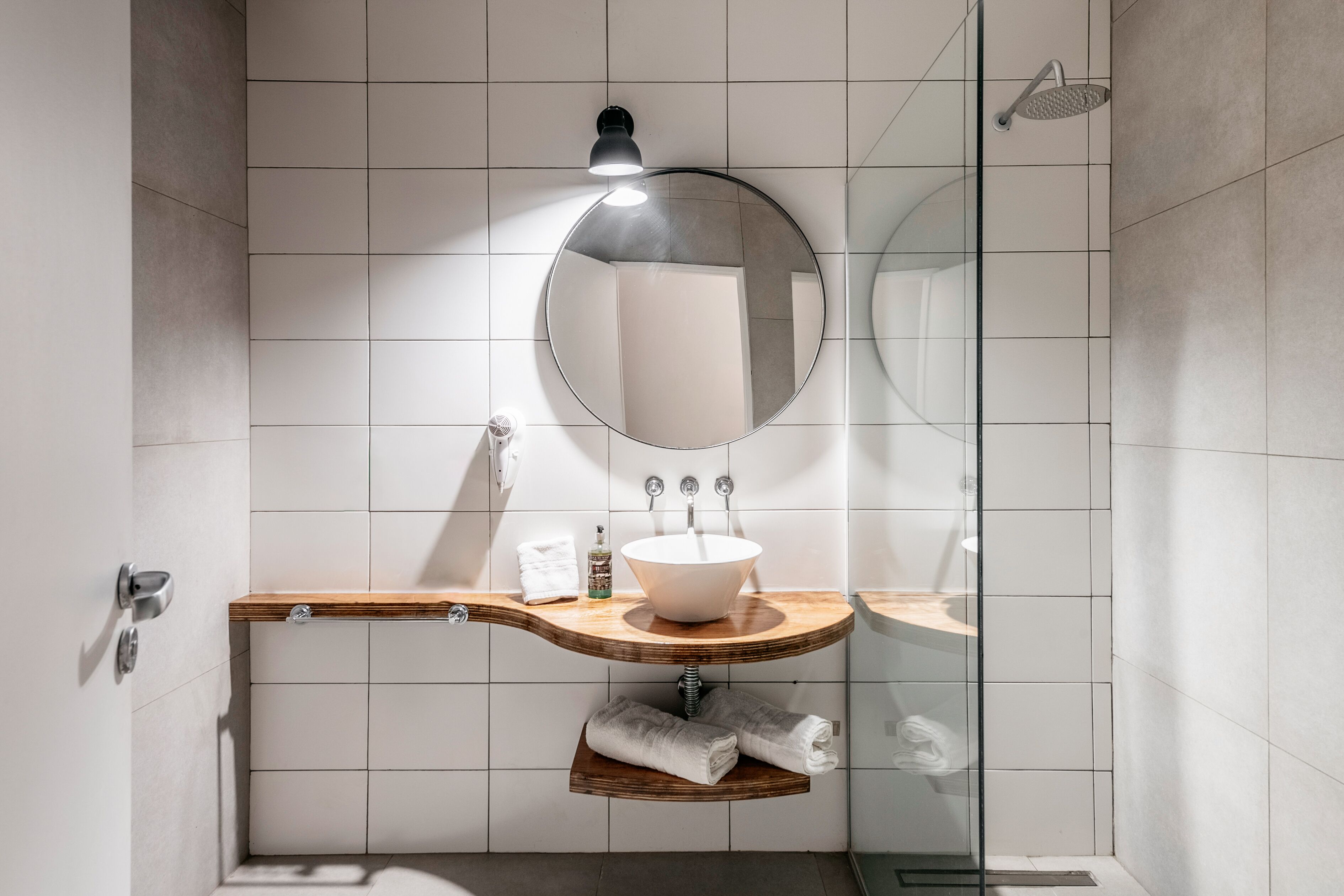 superior studio suite | bathroom | rainfall showerhead, free toiletries, hair dryer, bathrobes