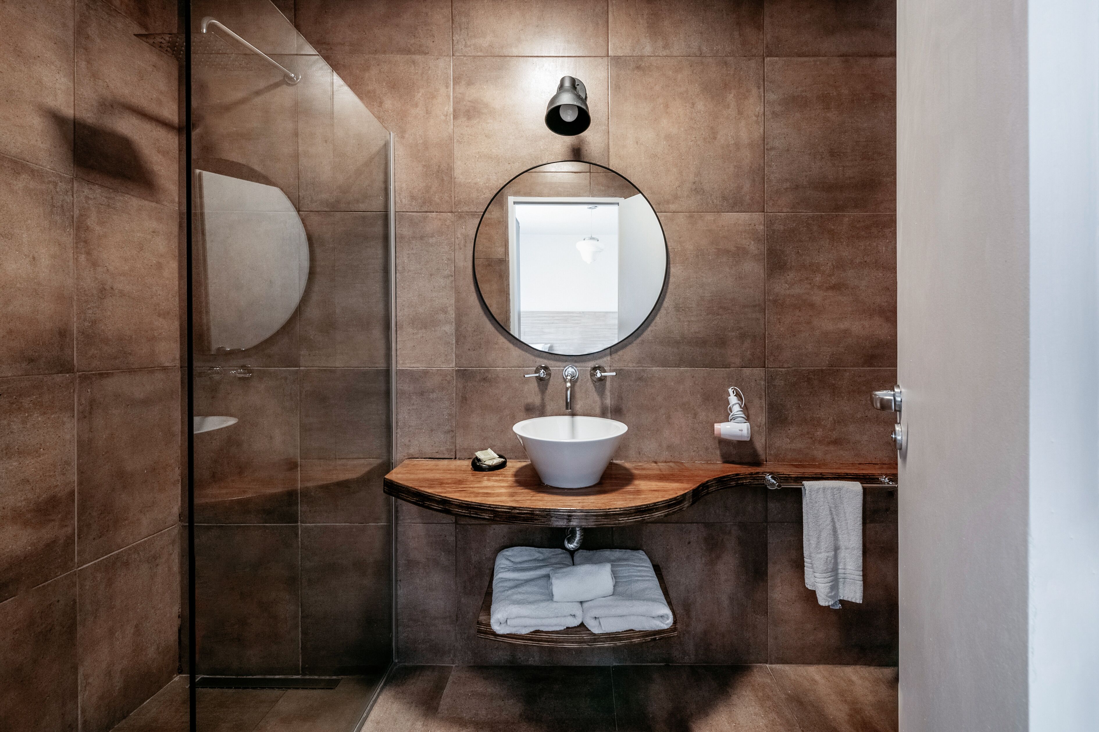 studio suite | bathroom | rainfall showerhead, free toiletries, hair dryer, bathrobes