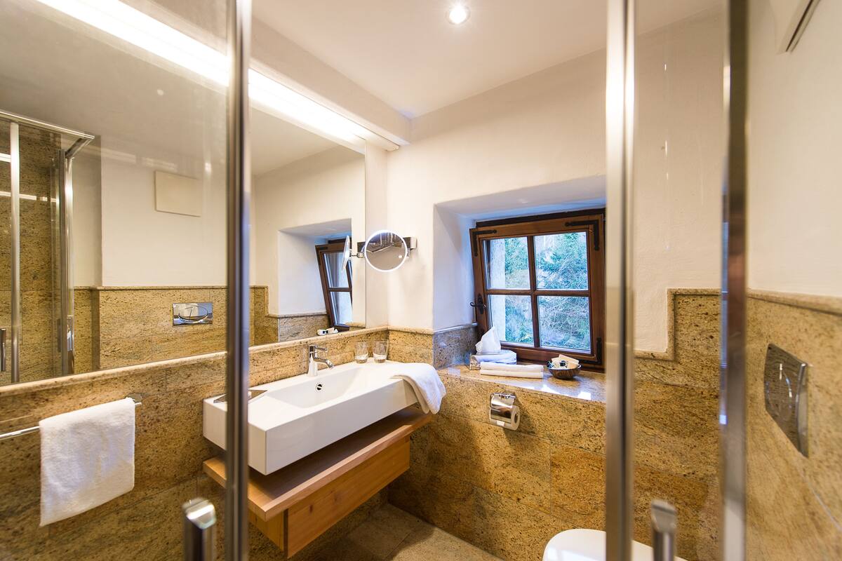 hydromassage showerhead, designer toiletries, hair dryer, bathrobes