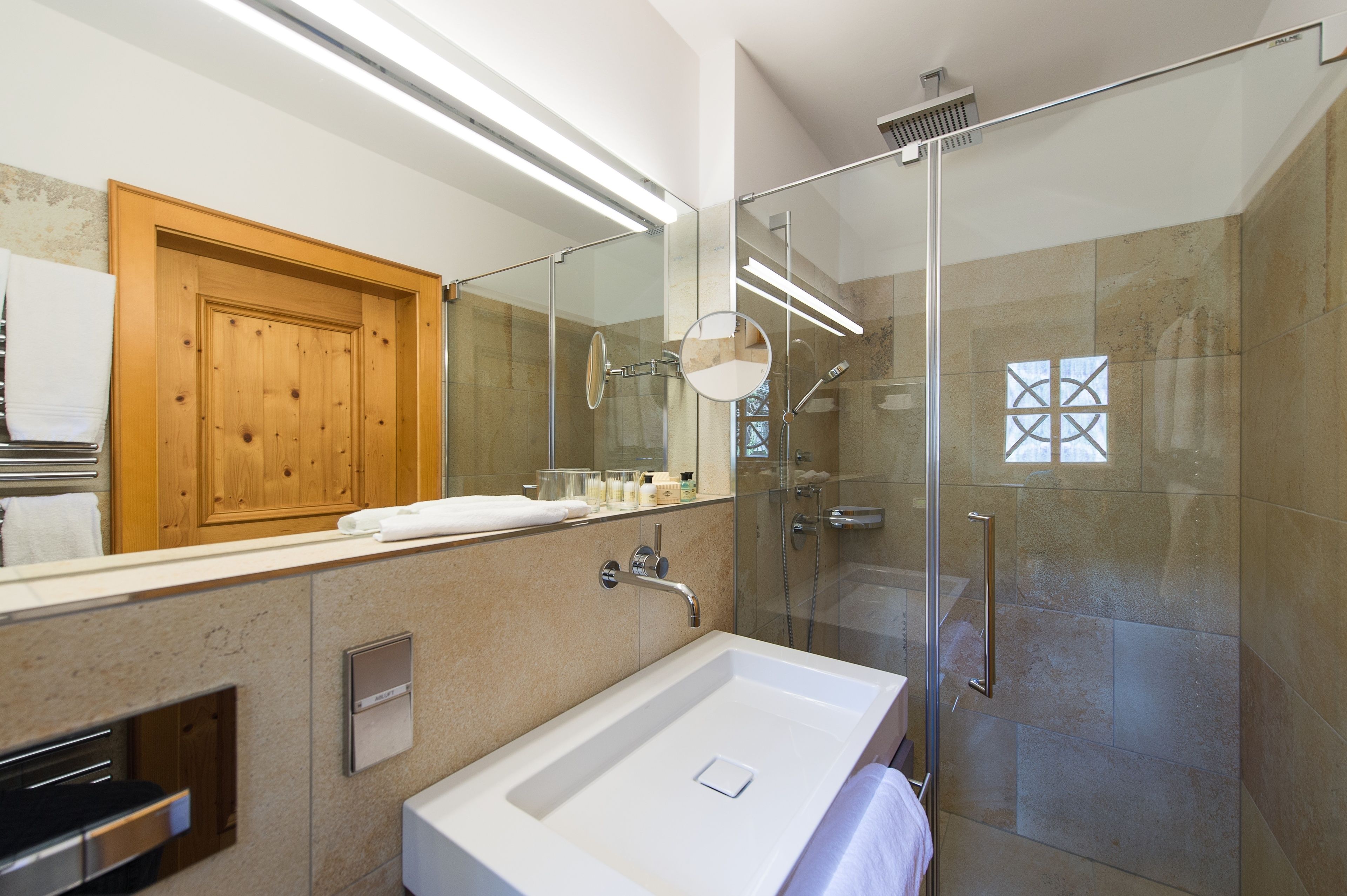 standard apartment (fischerhaus) | bathroom | hydromassage showerhead, designer toiletries, hair dryer, bathrobes