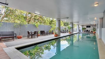 Outdoor pool, open 7:00 AM to 10:00 PM, pool loungers