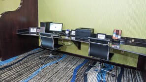 A hotel conference room with a desk, two chairs, a computer, and a telephone. - Holiday Inn Express & Suites Elkton - University Area by IHG (Elkton)