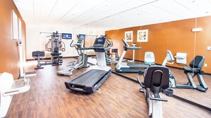 A gym with various exercise equipment, including treadmills, stationary bikes, and weight machines. - Holiday Inn Express & Suites Elkton - University Area by IHG (Elkton)
