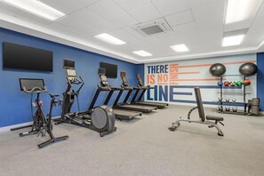 A gym with treadmills, stationary bikes, and exercise balls. - Hampton Inn & Suites Riverside/Corona East (Riverside)