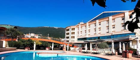 Outdoor pool, pool umbrellas, pool loungers
