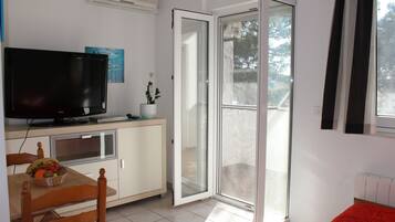 Standard Apartment, 1 Bedroom | Living area | 82-cm flat-screen TV with satellite channels, TV