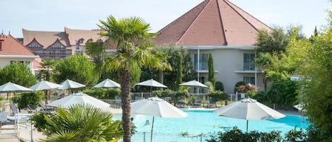 Seasonal outdoor pool, pool umbrellas, pool loungers