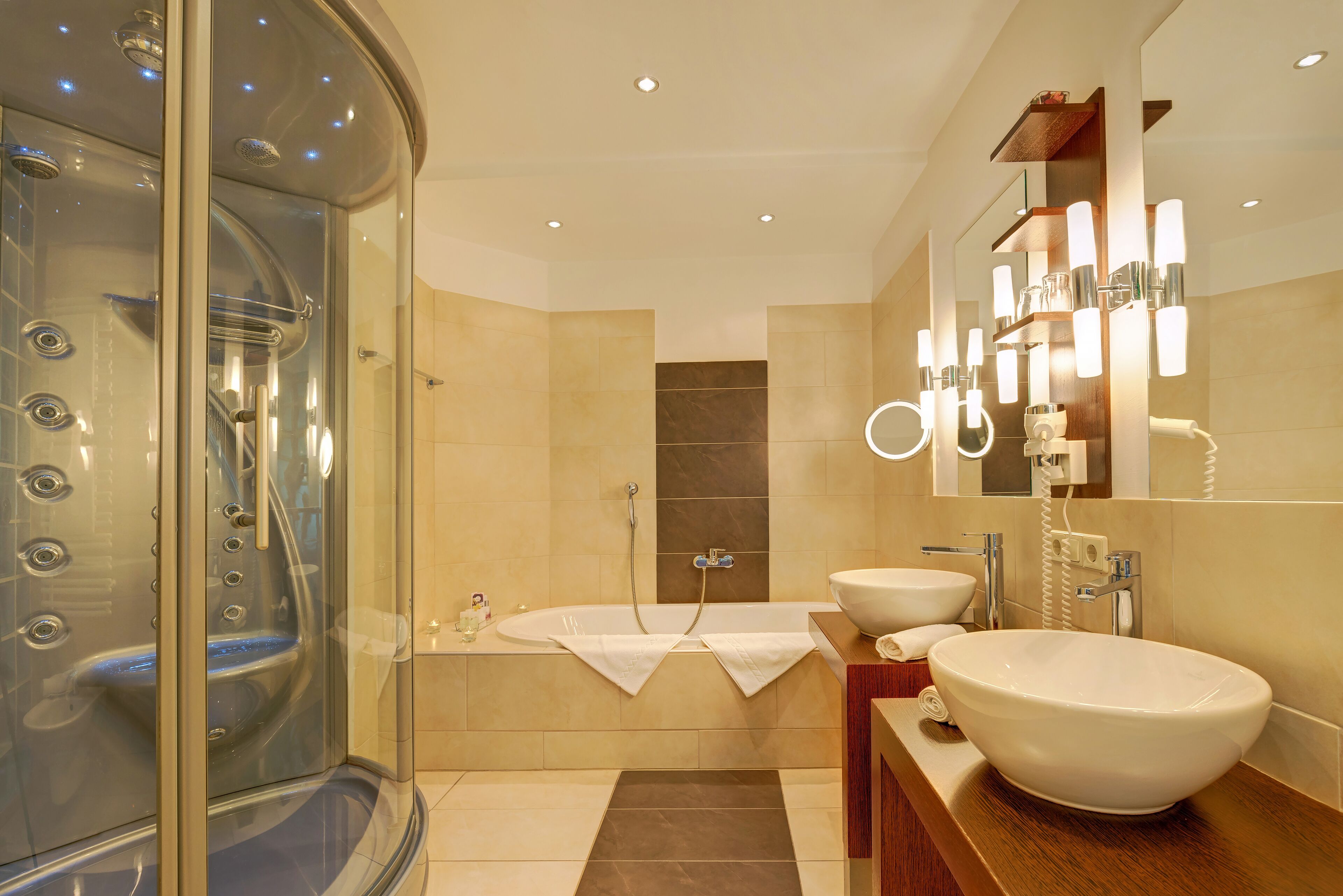 junior suite | bathroom | shower, hair dryer, bathrobes, slippers