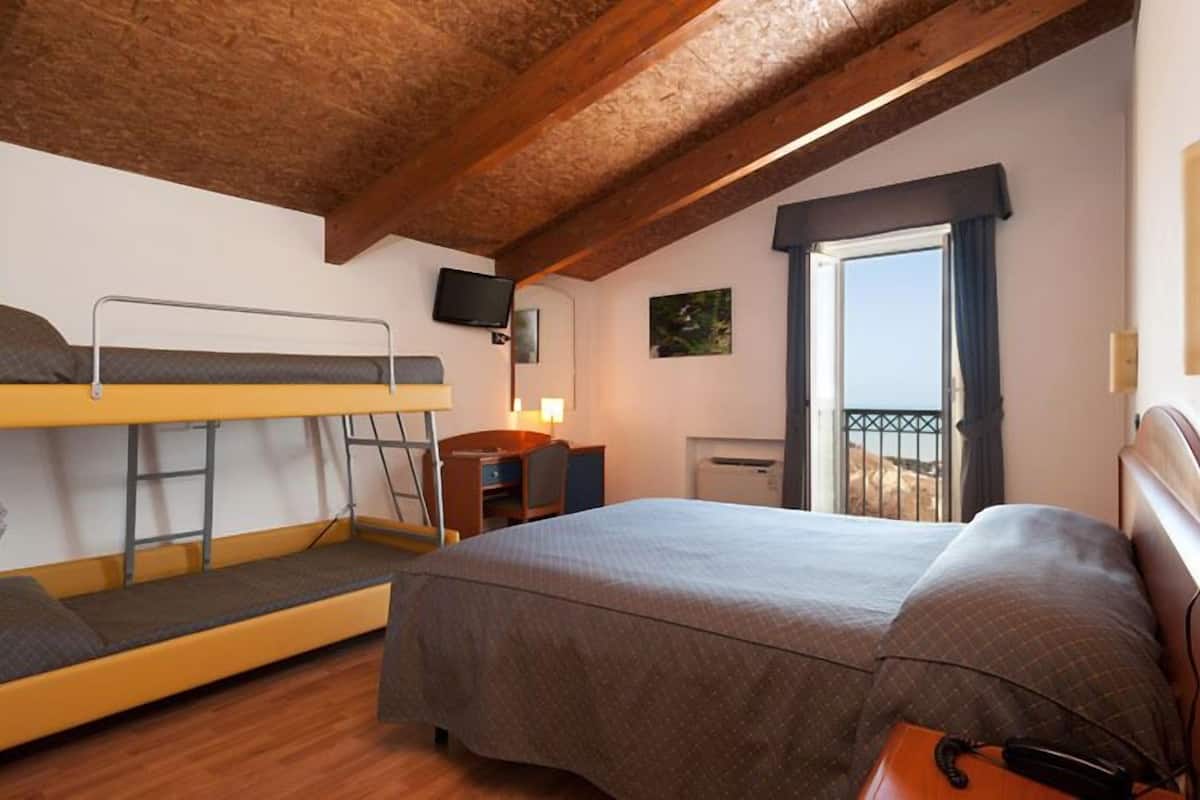 quadruple room | minibar, in-room safe, desk, iron/ironing board