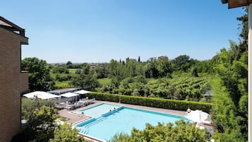 Seasonal outdoor pool, pool umbrellas, pool loungers