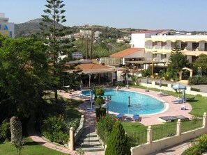 Seasonal outdoor pool, pool umbrellas, pool loungers