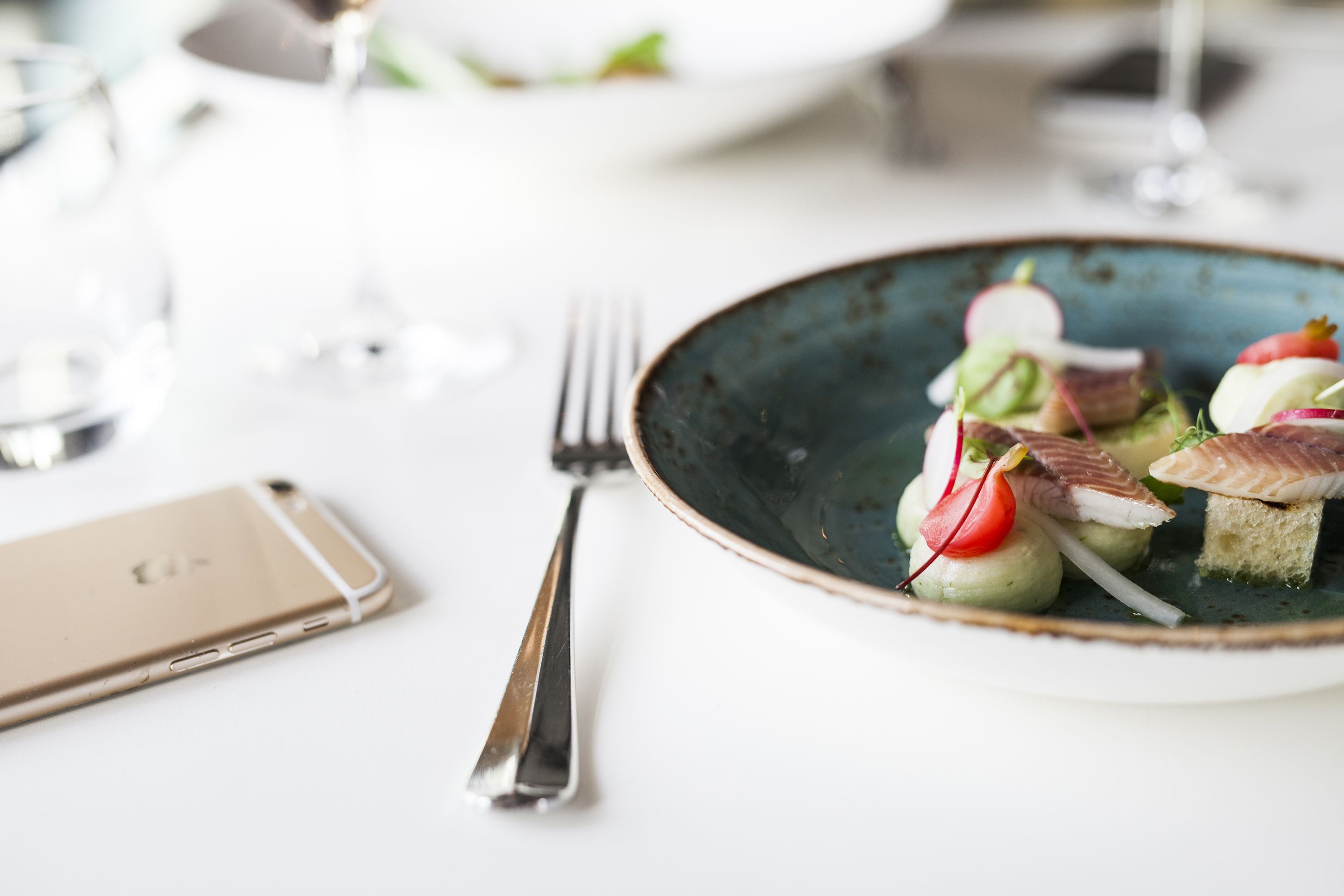 A plate of food with a fork beside it.