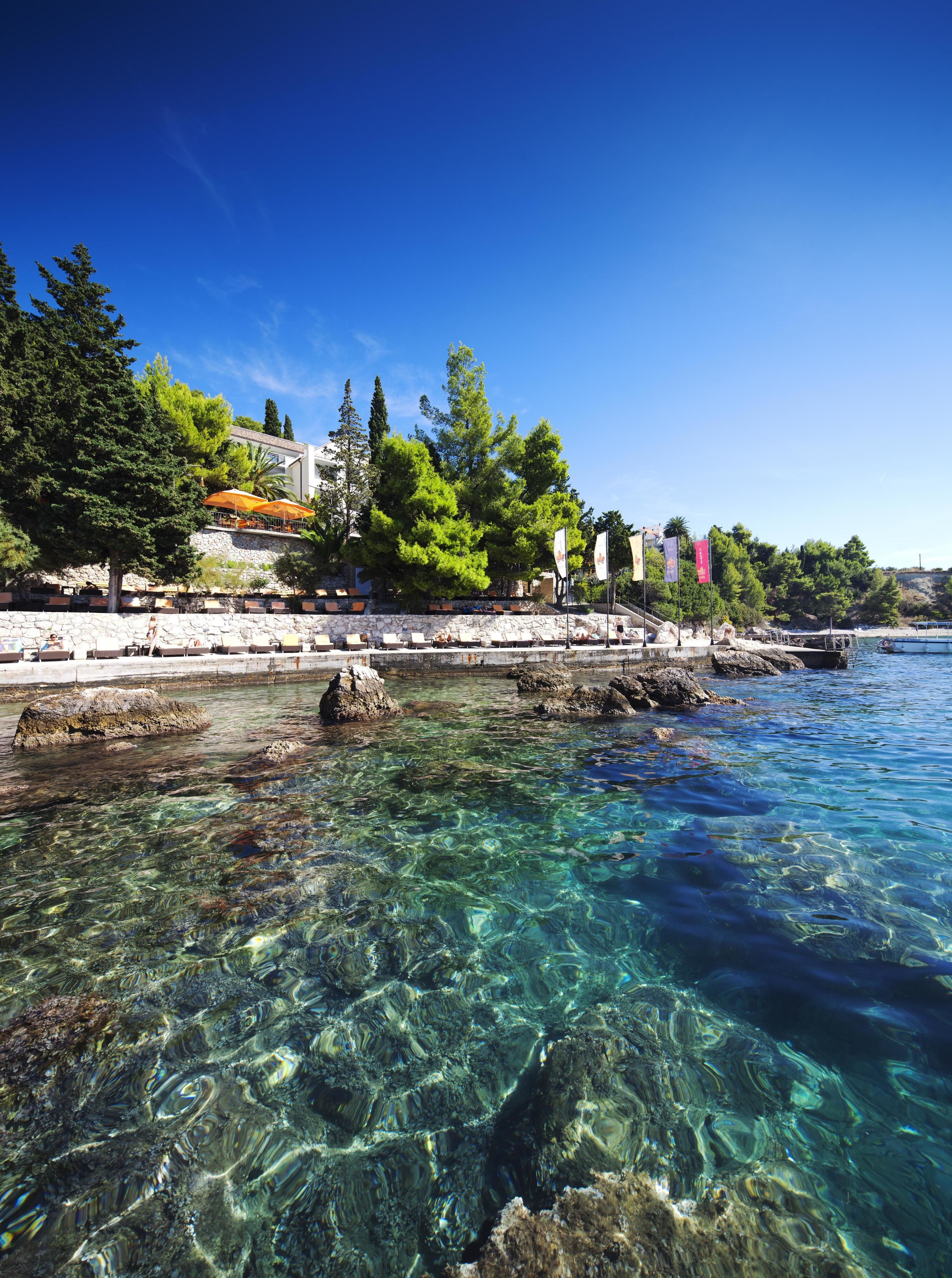 on the beach, sun-loungers, beach umbrellas, beach towels