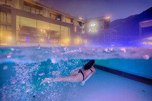A modern building with a large glass facade and a sign reading "A&L". - LUNARIS Wellnessresort (Valle Aurina)