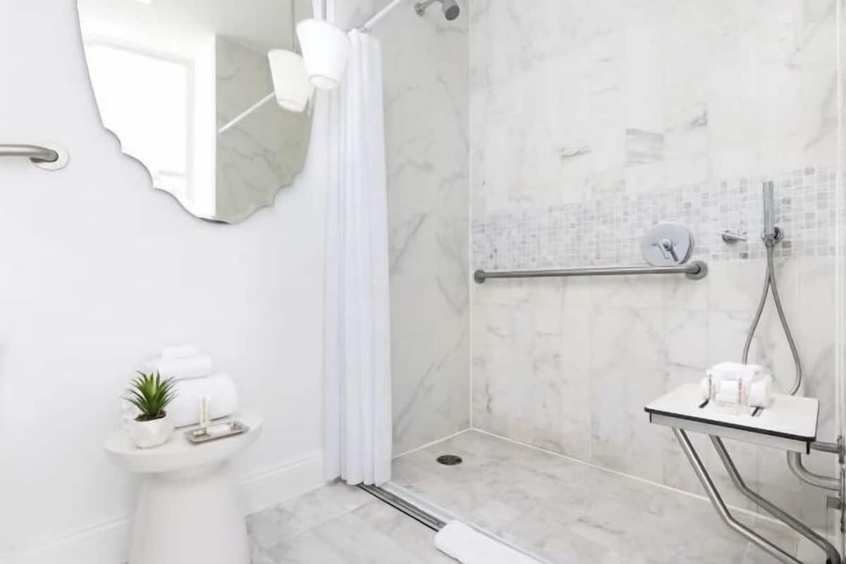 Bathroom | Shower, designer toiletries, hair dryer, towels