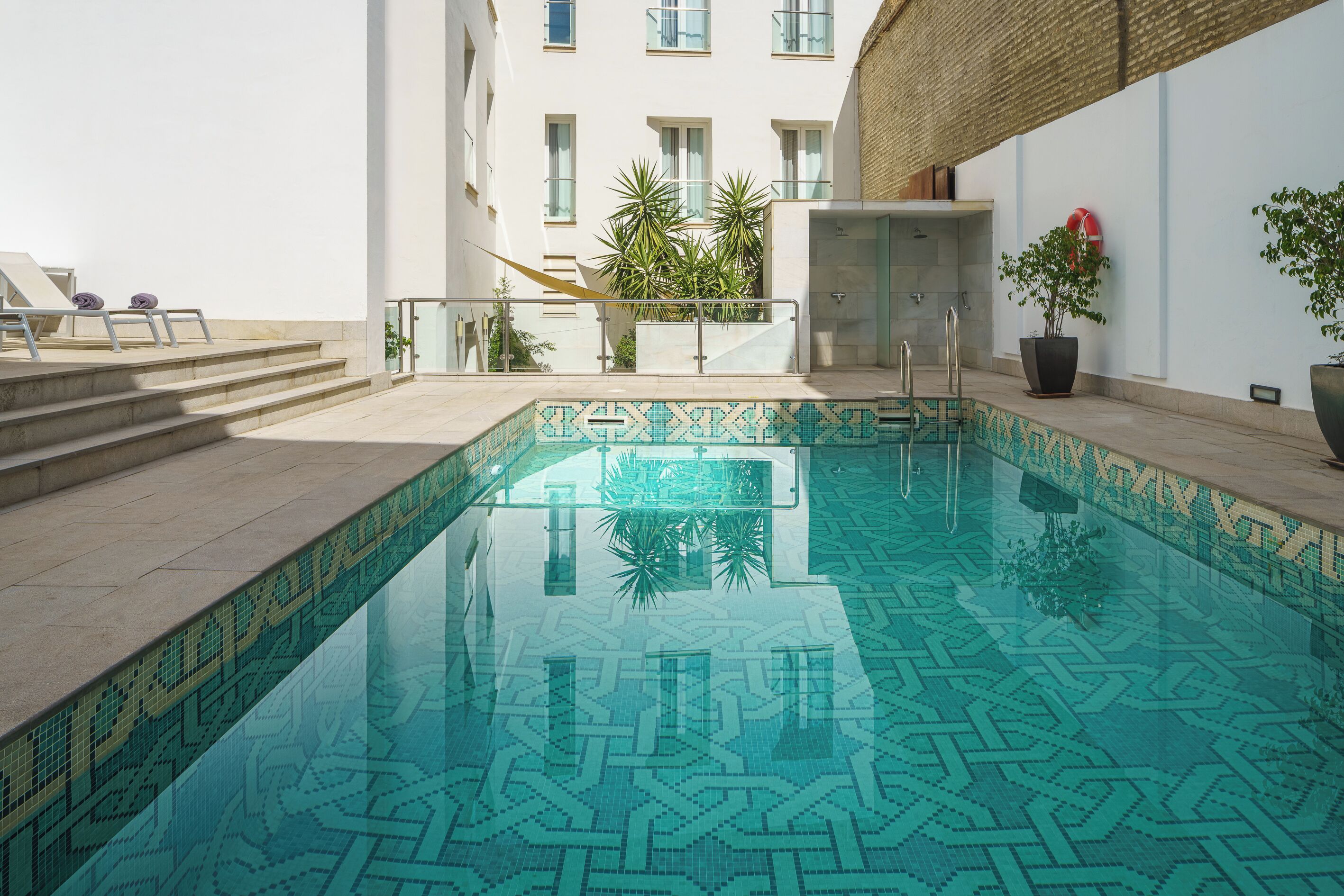 seasonal outdoor pool, open 11:00 am to 8:00 pm, pool loungers