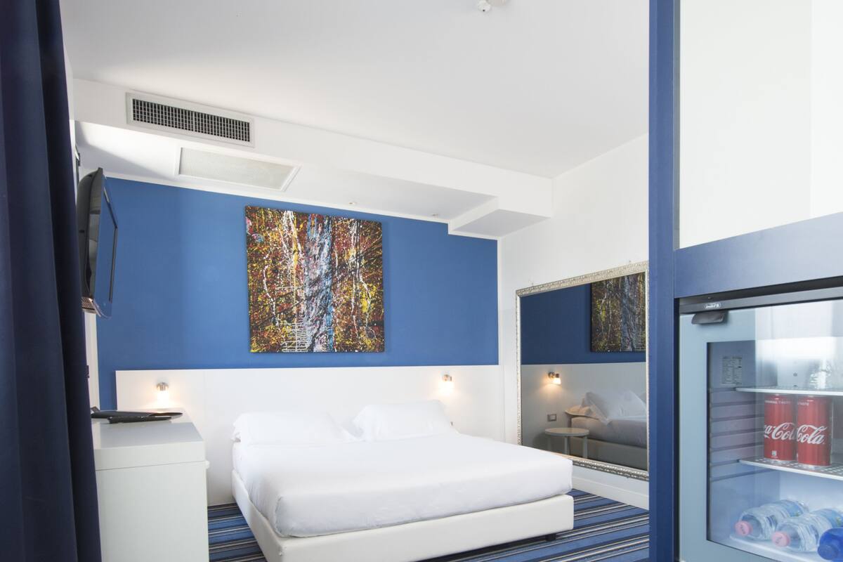 hypo-allergenic bedding, down duvets, minibar, in-room safe