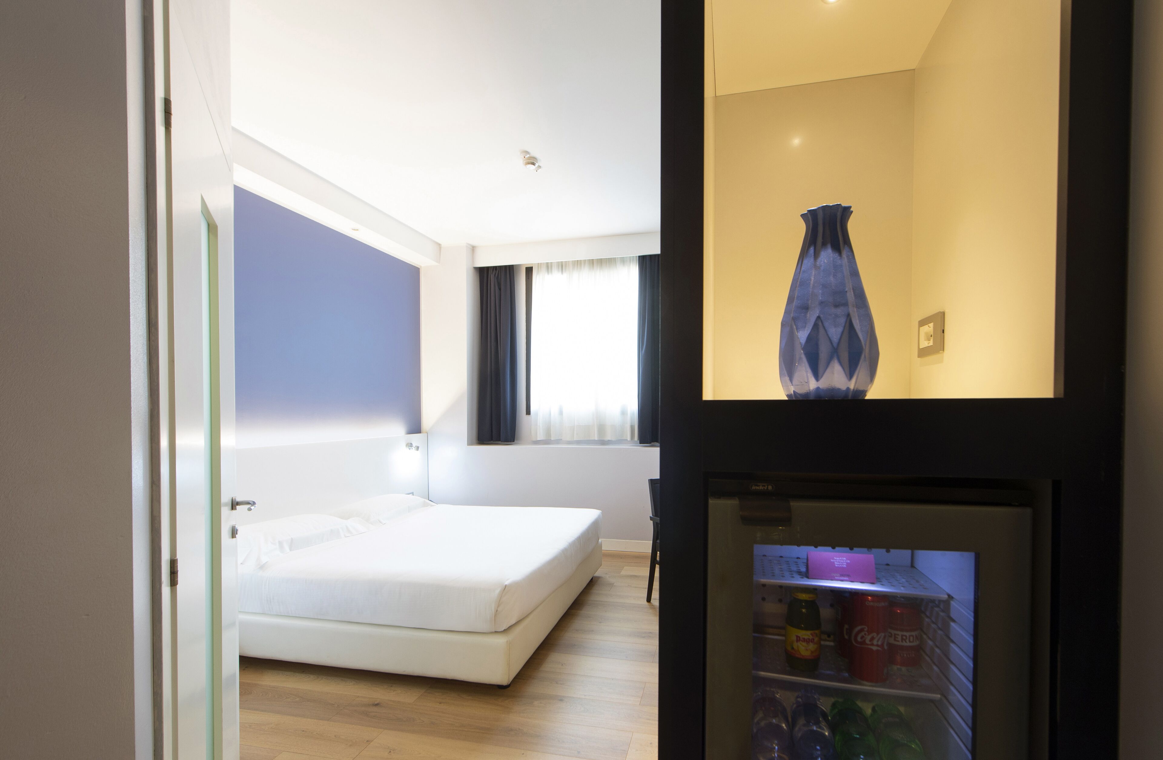 hypo-allergenic bedding, down duvets, minibar, in-room safe