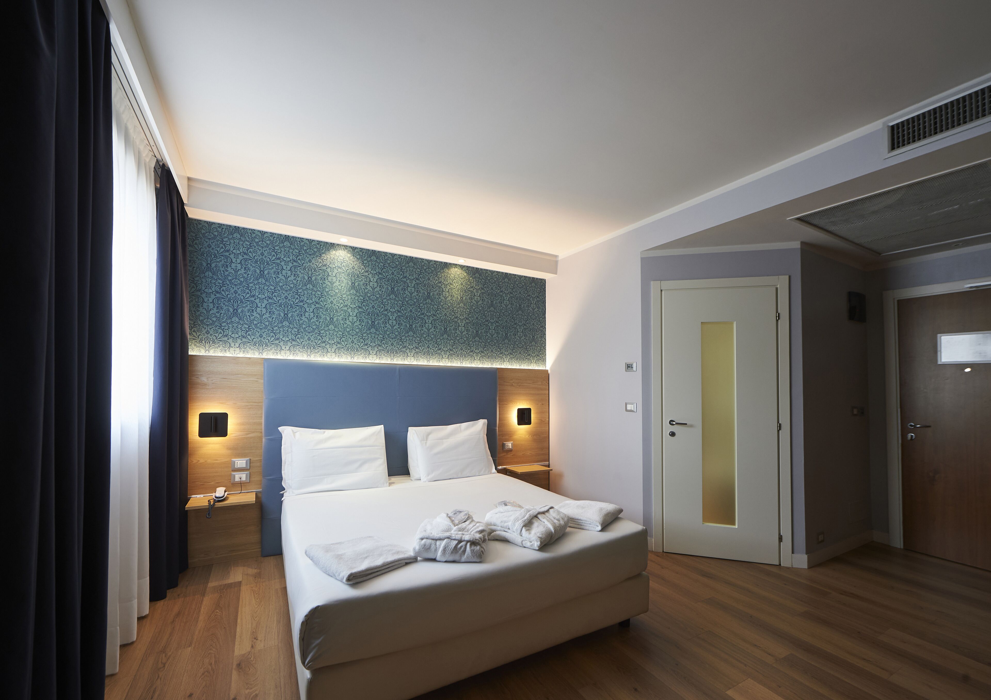 deluxe double room | hypo-allergenic bedding, down duvets, minibar, in-room safe