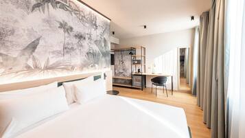 Camera Comfort con letto matrimoniale o 2 letti singoli | Biancheria da letto ipoallergenica, copriletto in piuma, minibar