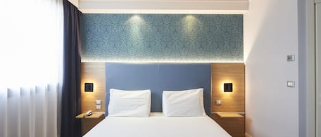 Hypo-allergenic bedding, down duvets, minibar, in-room safe