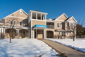 Stunning two-story building with a welcoming entrance and covered walkway.