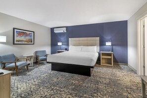 Suite, 1 King Bed, Non Smoking, Kitchenette (with Single Sofabed) | Desk, laptop workspace, blackout drapes, iron/ironing board