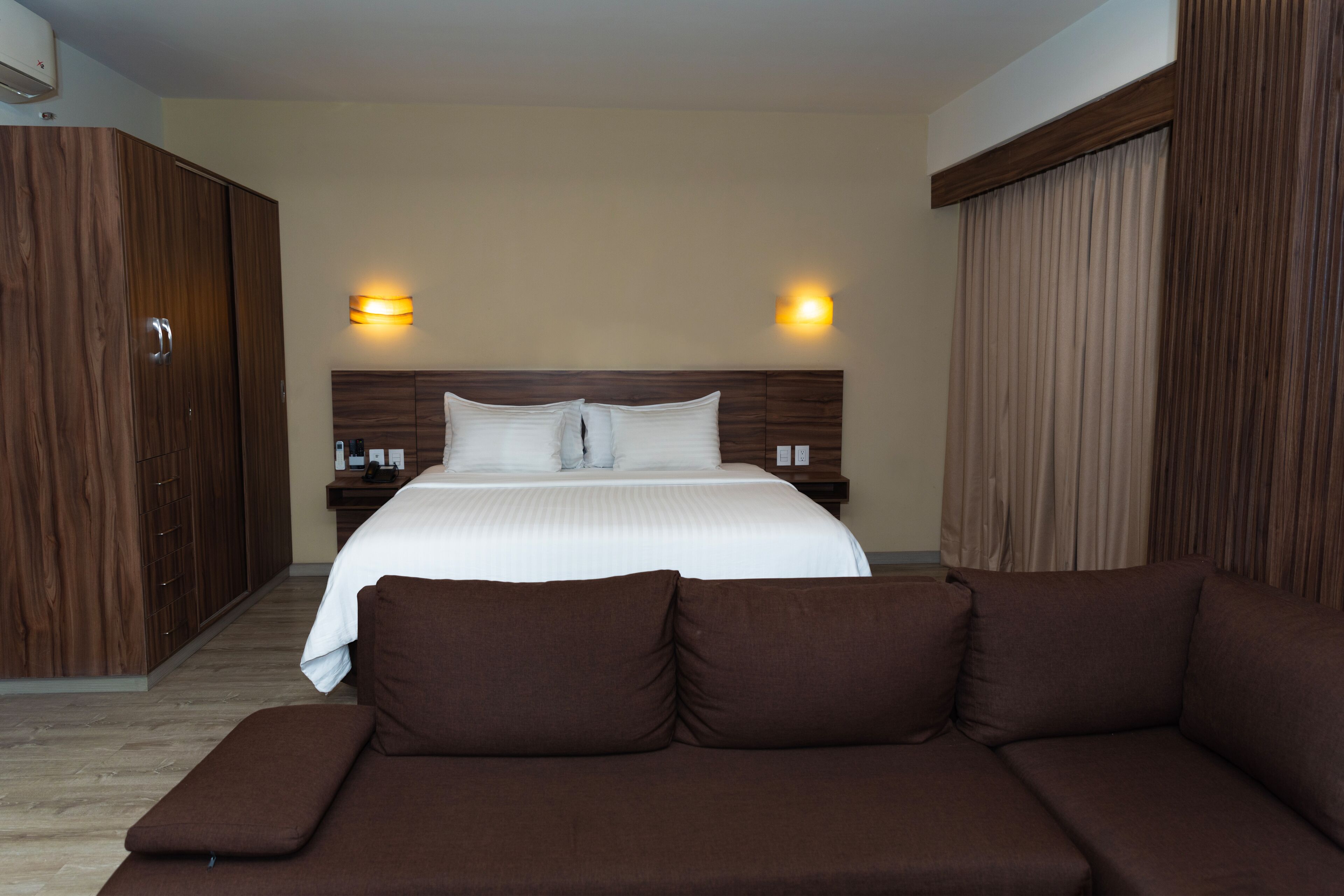 junior suite, 1 king bed, kitchenette | 1 bedroom, premium bedding, minibar, in-room safe
