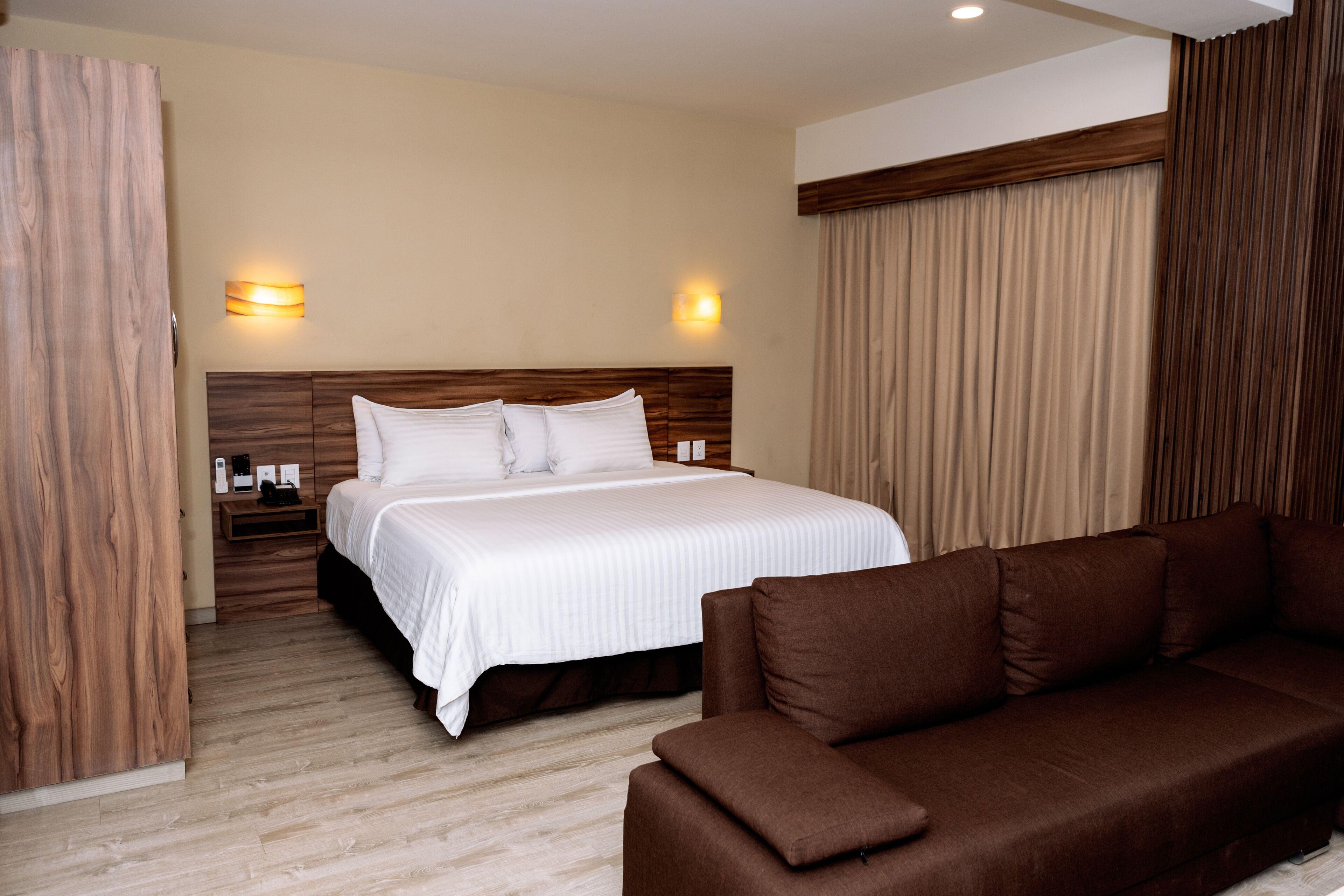 junior suite, 1 king bed, kitchenette | 1 bedroom, premium bedding, minibar, in-room safe