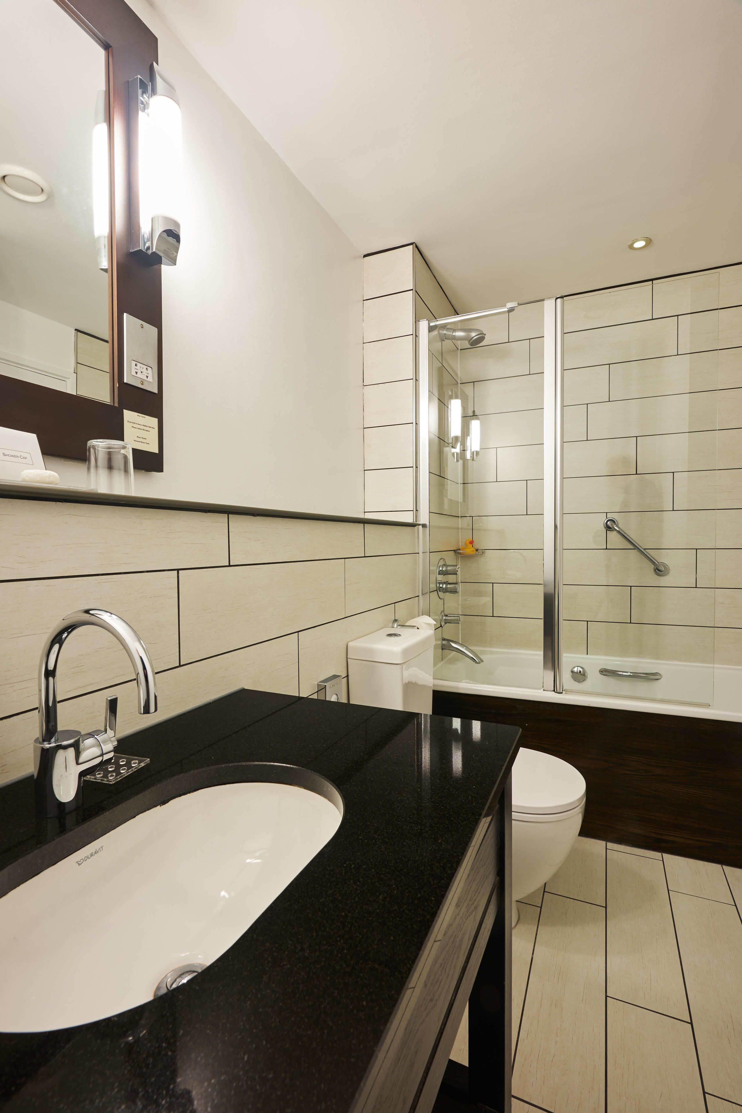 designer toiletries, hair dryer, towels