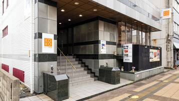 A building with a sign reading "KOKO Stay".