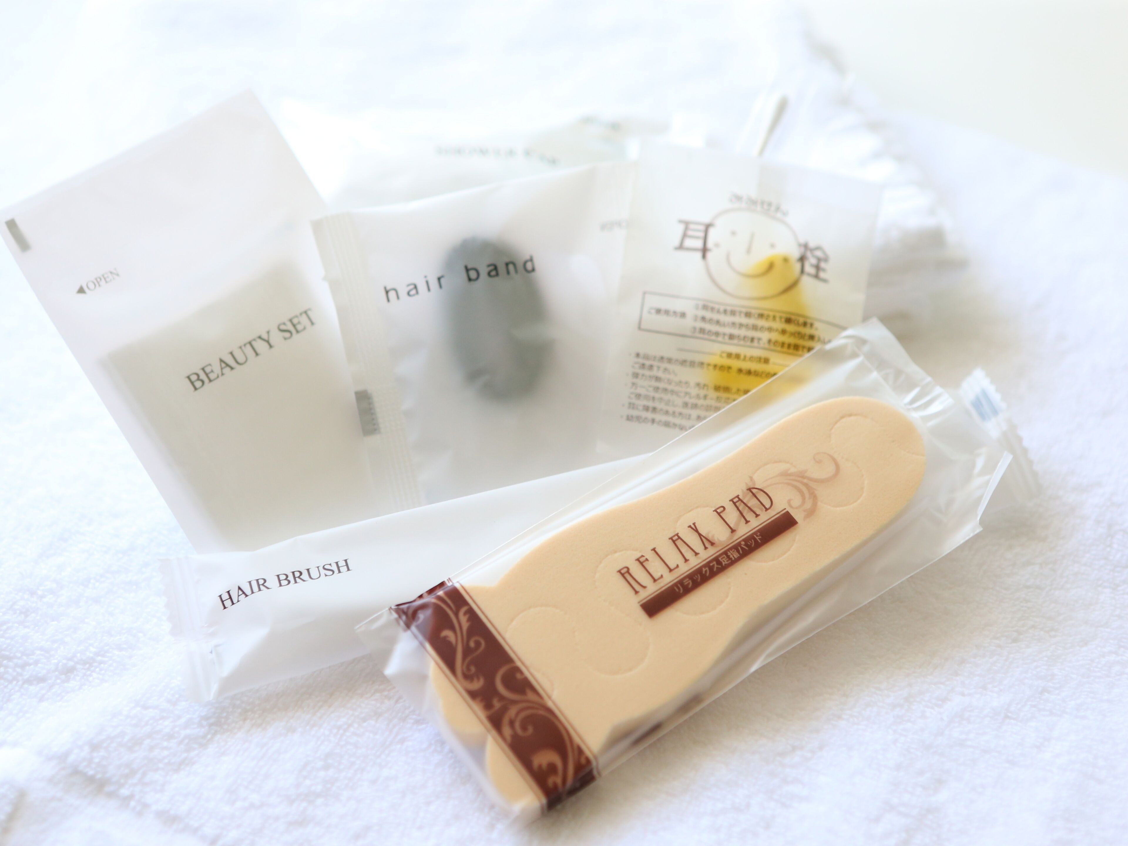 A beauty set including a hair brush, a hair band, and a relax pad.