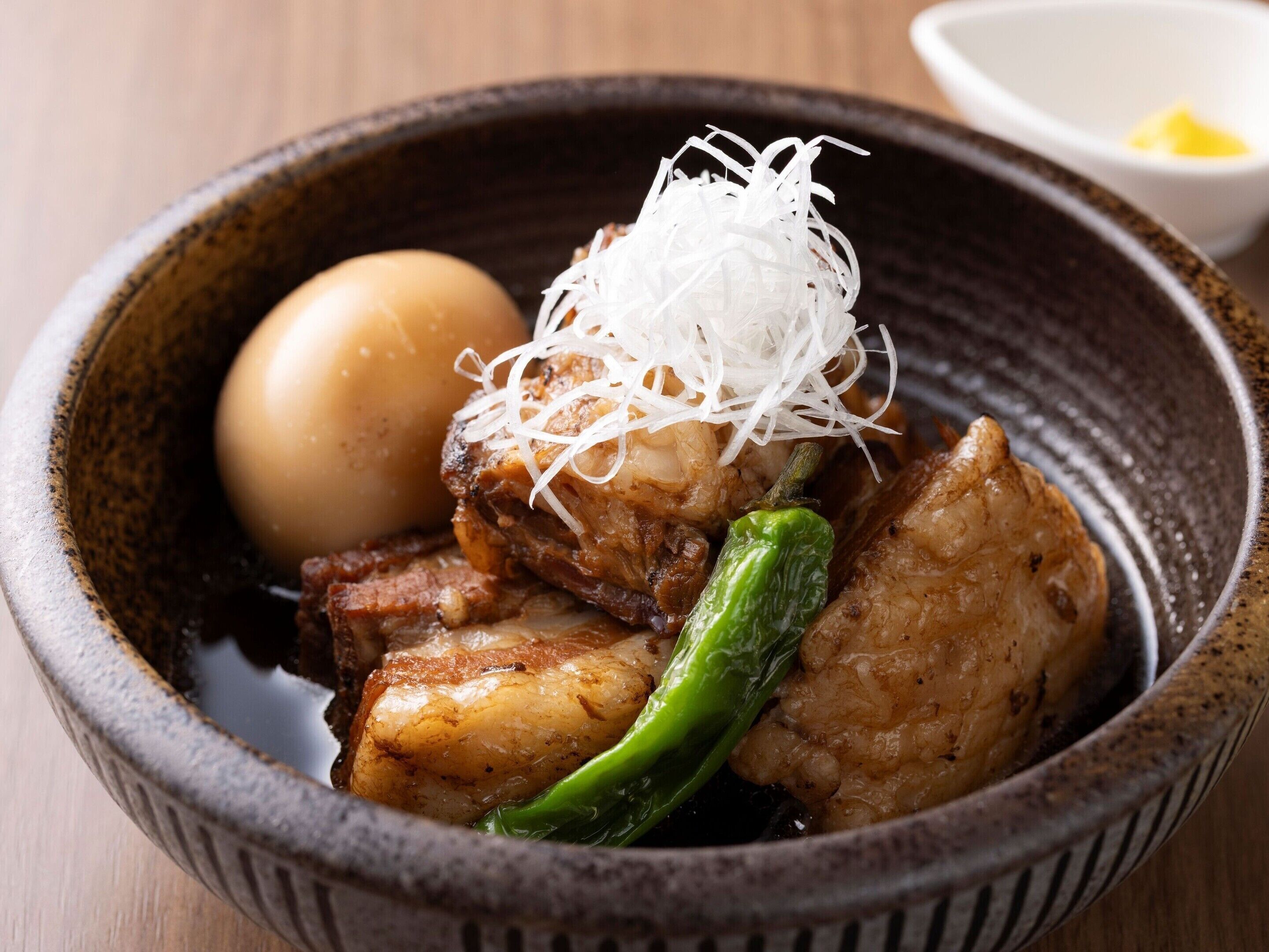 A bowl of food with various ingredients.