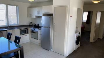 Deluxe Apartment, 2 Bedrooms, Non Smoking, Jetted Tub | Private kitchen | Mini-fridge, microwave, electric kettle, toaster