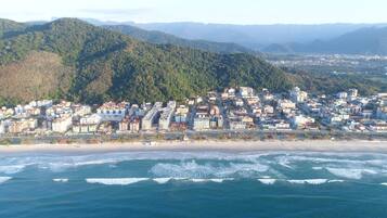 Beach nearby, white sand, beach umbrellas, beach towels