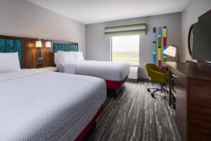 A hotel room with two beds, a desk, a chair, and a large window. - Hampton Inn Colby (Colby)