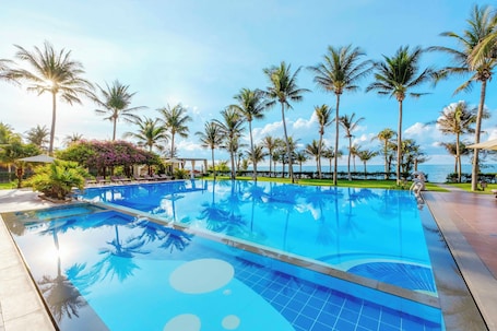 2 outdoor pools, open 7:00 AM to 8:00 PM, pool umbrellas, pool loungers. Sunny Beach Resort & Spa Mui Ne