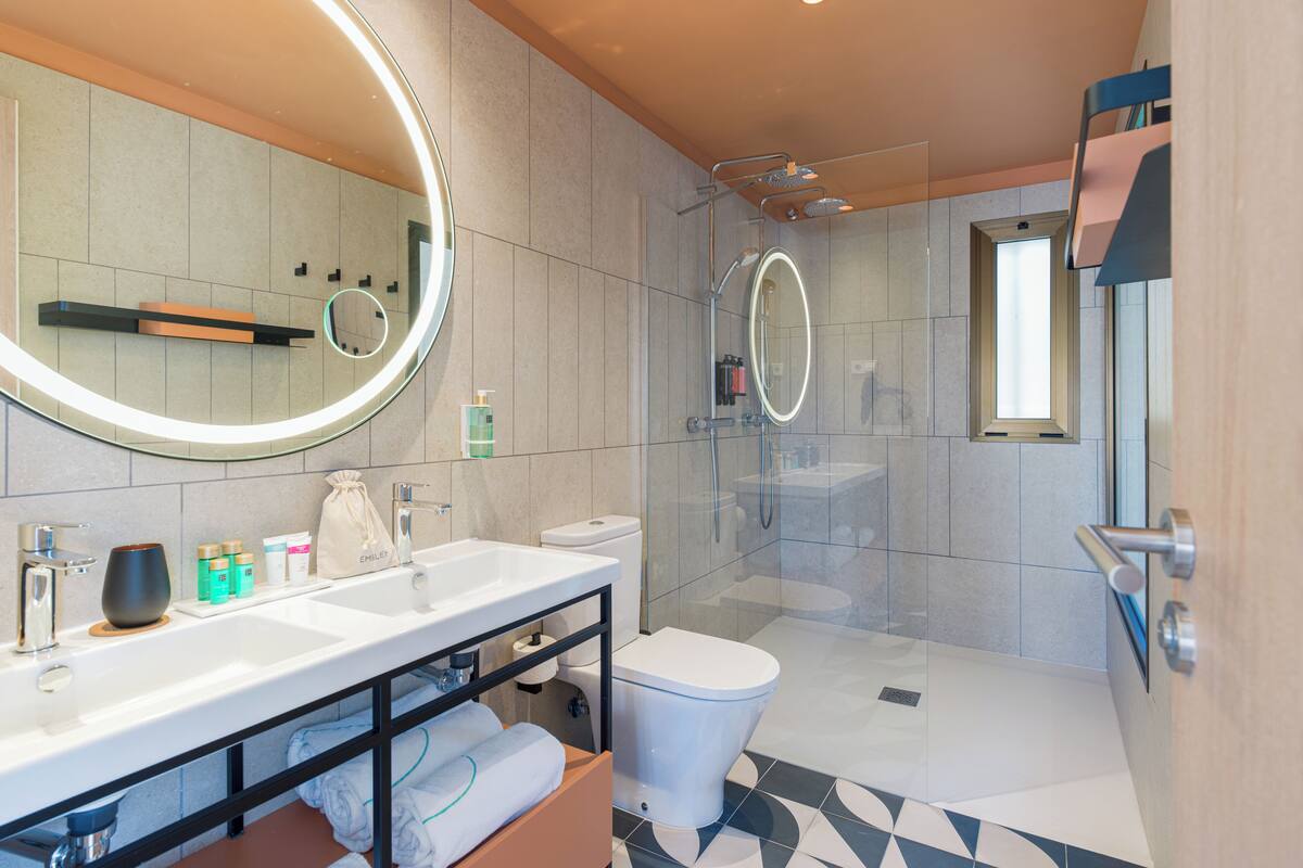 shower, rainfall showerhead, hair dryer, towels