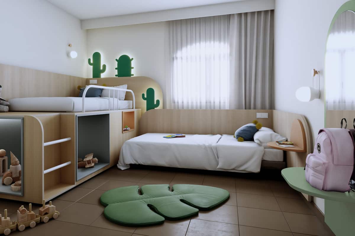 Une chambre conçue pour les enfants, avec des lits superposés, un espace de jeux et un tapis vert.