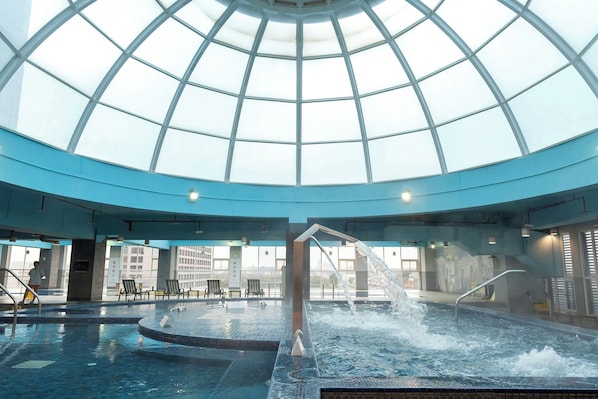 Indoor pool, open 9:00 AM to 10:00 PM, pool loungers, lifeguards on site