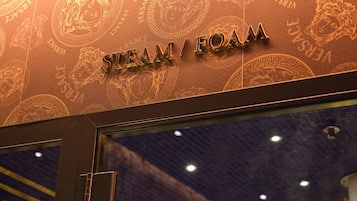 A storefront with the text "STEAM FOAM" and a decorative pattern.