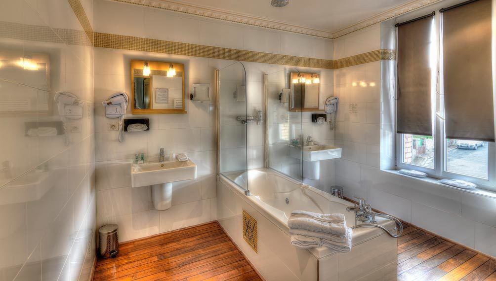 junior suite | bathroom | bathtub, jetted bath, designer toiletries, hair dryer